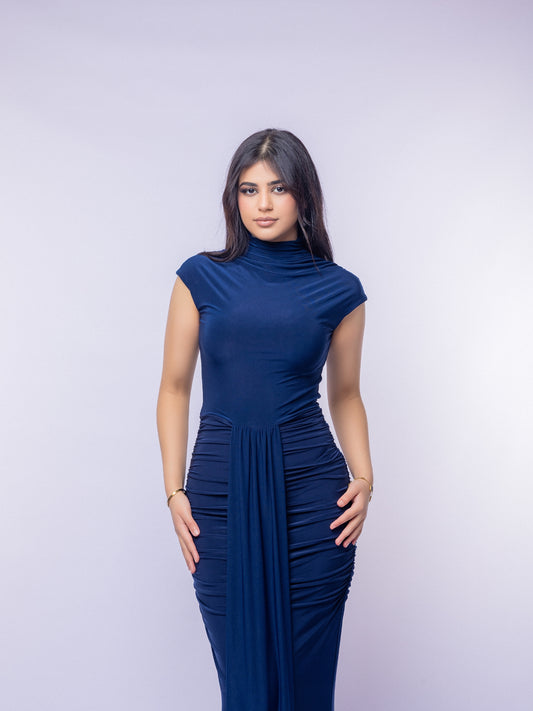Woman wearing a blue dress against a white background