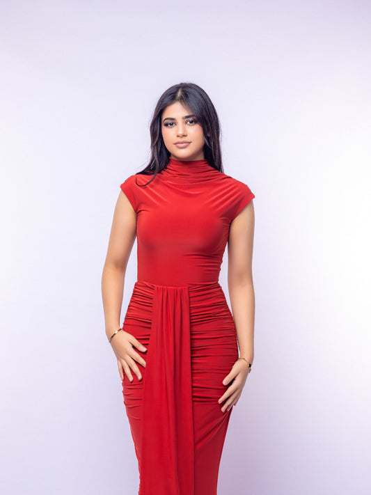 Woman wearing a red dress against a white background
