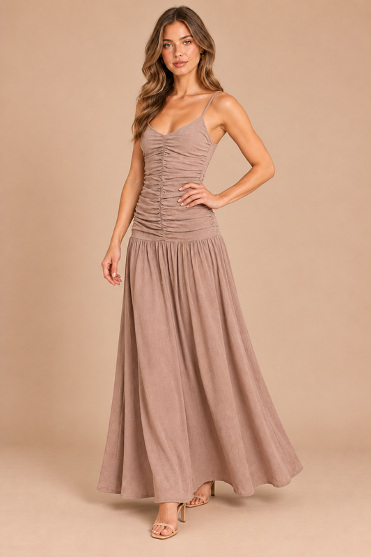 Three-quarter view of taupe ruched drop waist maxi dress