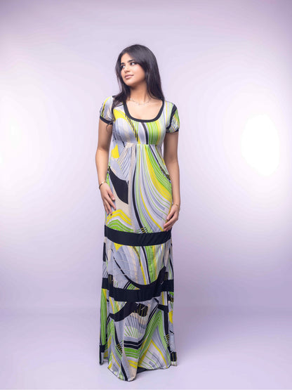 Woman wearing a patterned dress on a white background