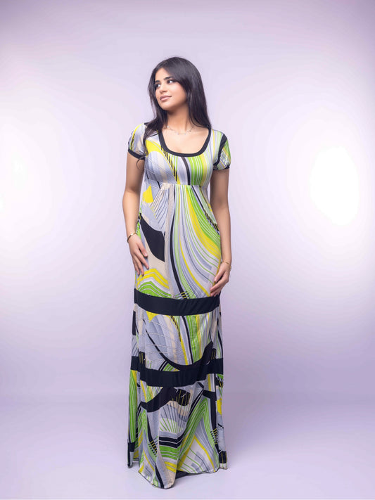 Woman wearing a patterned dress on a white background