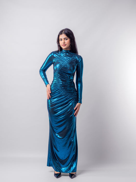 Woman wearing a blue metallic dress against a white background