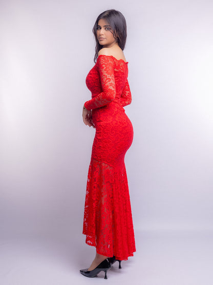 Woman wearing a red lace dress against a white background