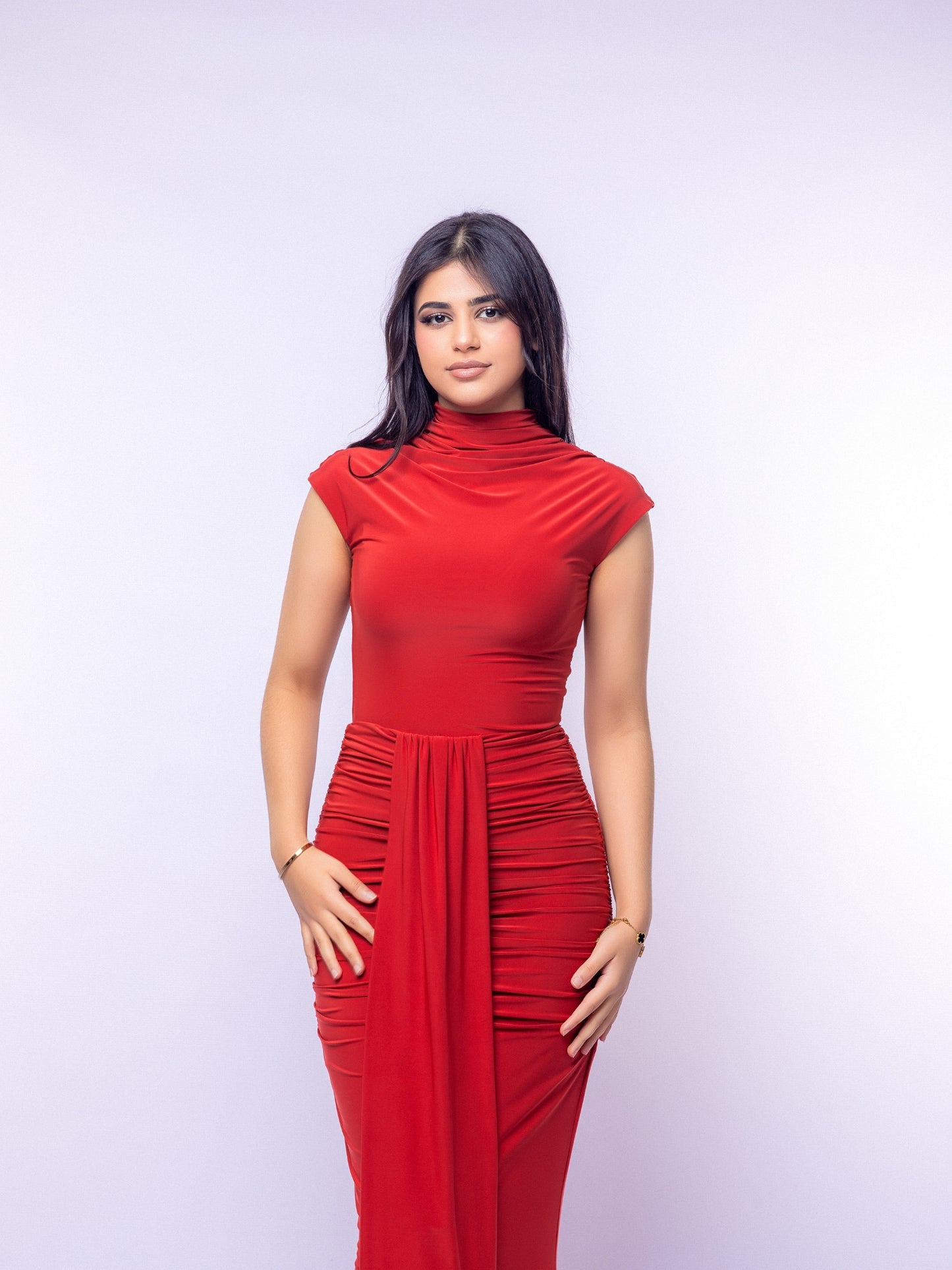 Woman wearing a red dress against a white background