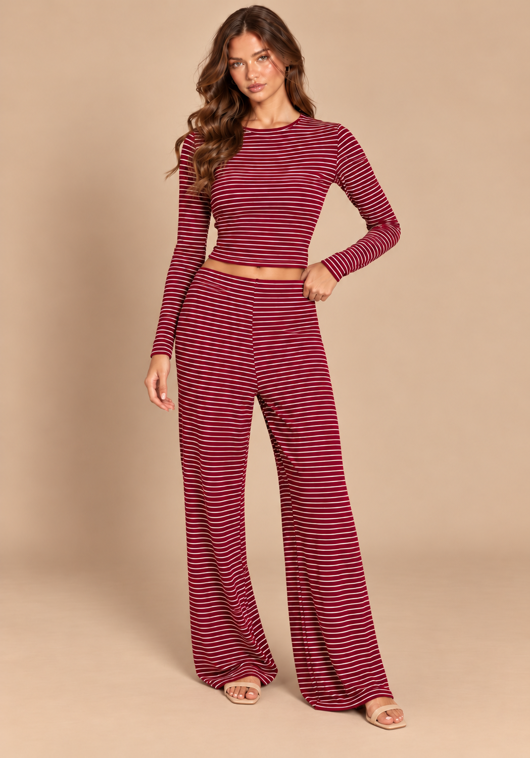 Front view of burgundy striped crop top and matching wide-leg trousers